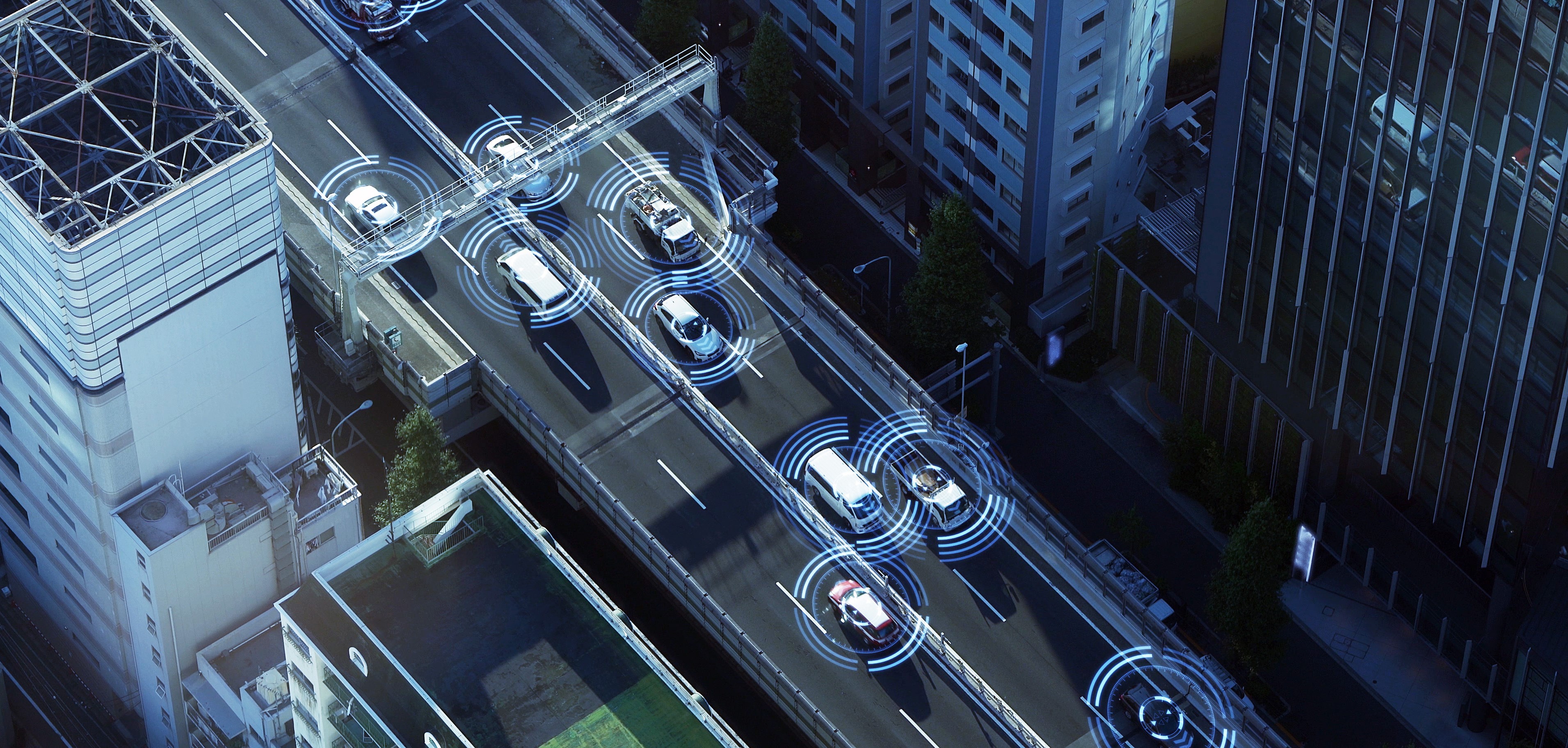 top view of a highway with cars driving on it