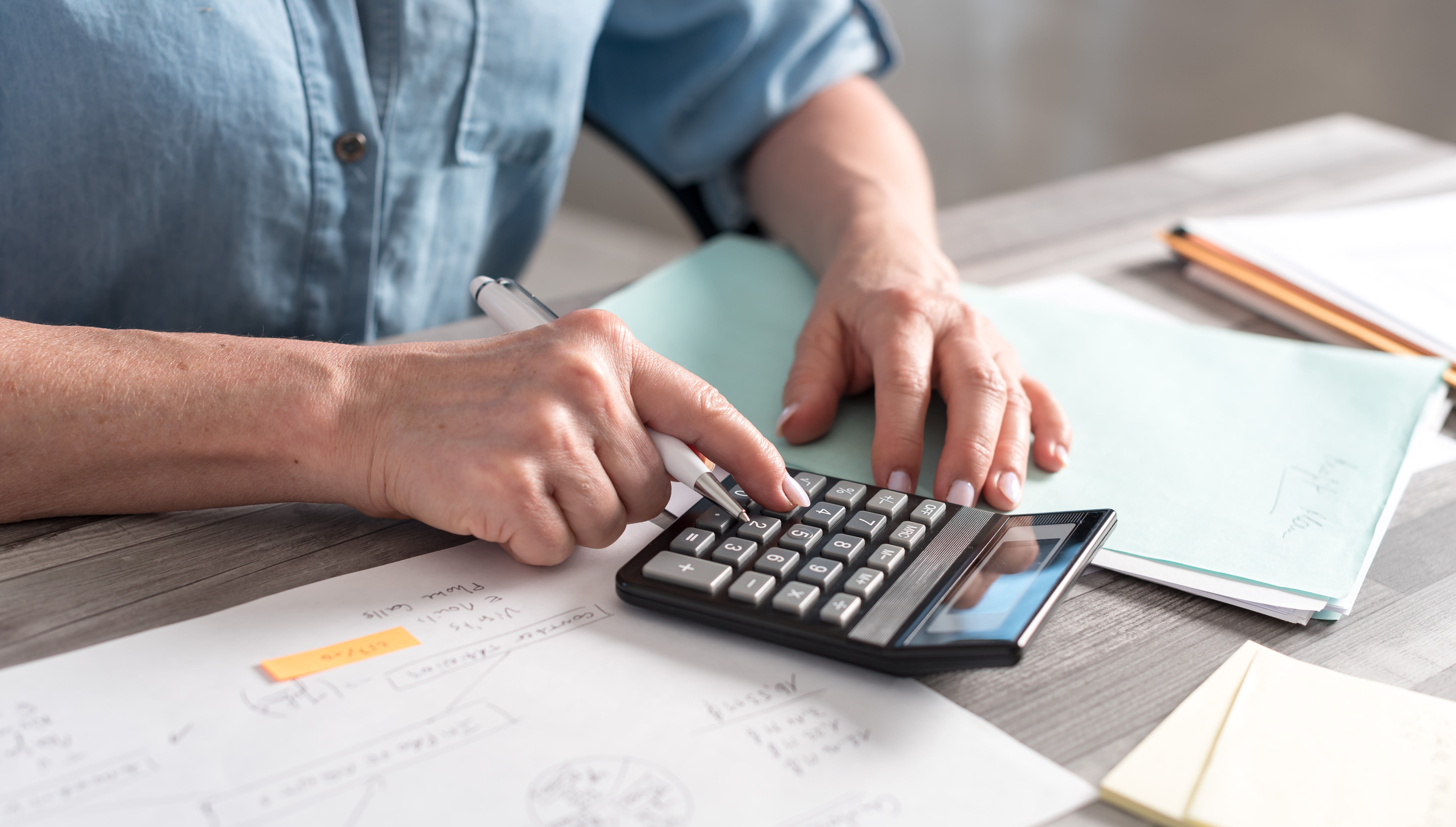 man using a calculator