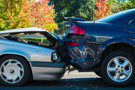 car accident, grey car hitting the back of another car