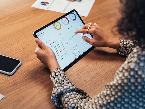 women looking at a graph on her ipad