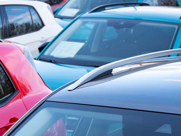 cars parked in a car yard 