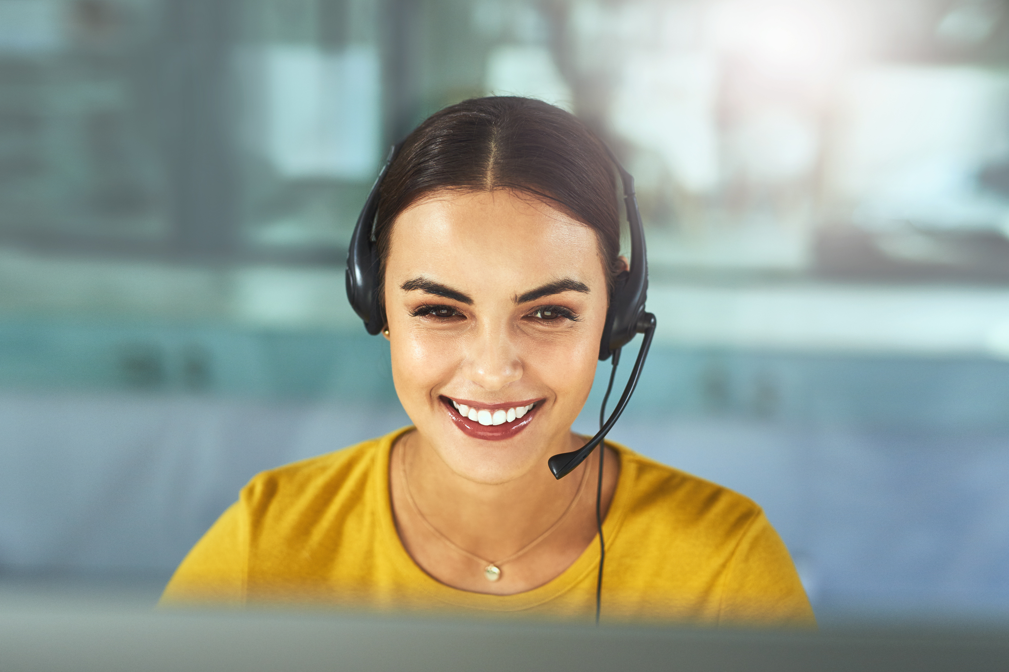 women with a headset on smiling