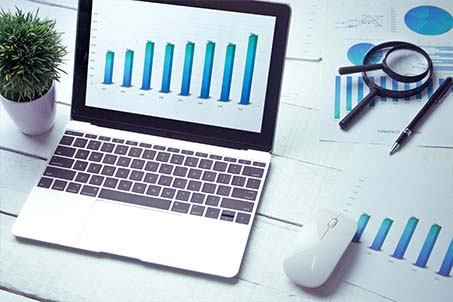 a laptop screen showing a graph 