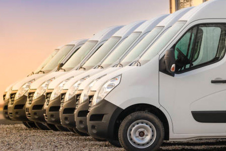 white vans parked in a line together