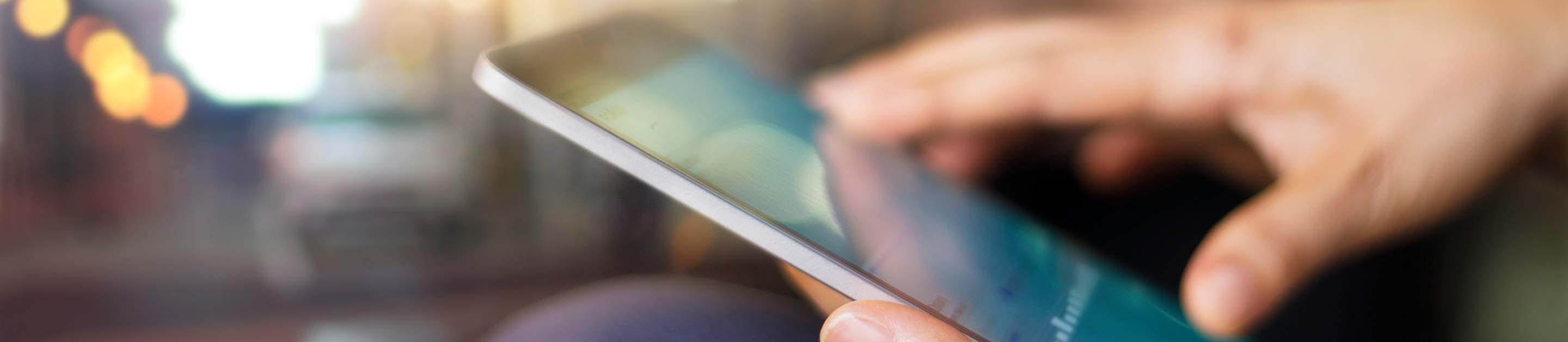 a guy looking at his phone screen 
