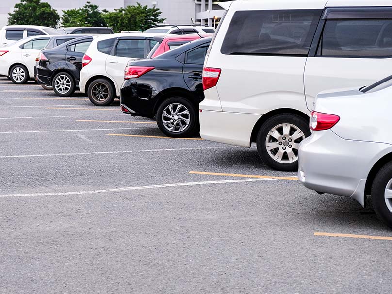 lots of cars parked in a parking lot